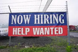 Fewer Americans file for jobless benefits last week as layoffs remain at historically healthy levels